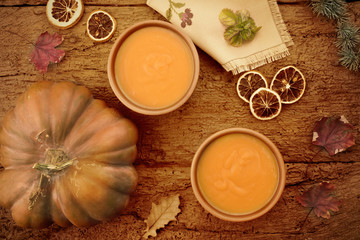 Pumpkin cream on a rustic table