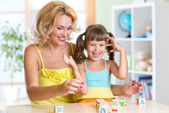 Happy family plays in home interior