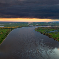 Top view of calm river in autumn evening