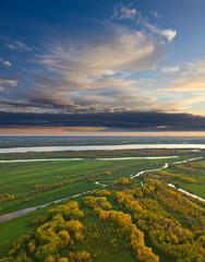 Top view of calm river in autumn evening