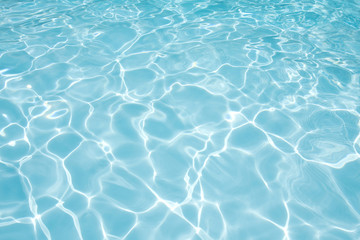 Naklejka na ściany i meble Blue water rippled background in swimming pool