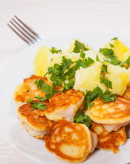 pieces of fish fillets in batter with potato