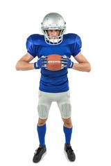 Fototapeta na wymiar Full length portrait of American football player holding ball