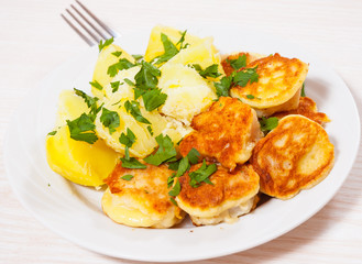 pieces of fish fillets in batter with potato