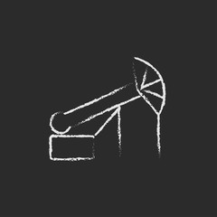 Pump jack oil crane icon drawn in chalk.