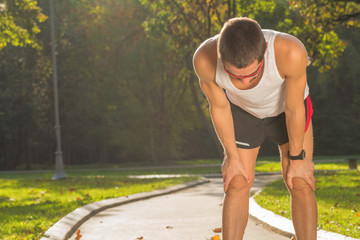 Tired jogger in the park.
