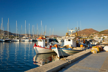 Fishing boats and sail boats in the port of Parikia, the capital and main port of Paros island in...