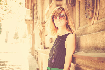 Fototapeta premium Urban girl posing in a classic European street surroundings.