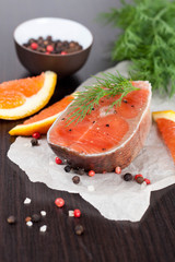 fresh salmon steak and ingredients for cooking
