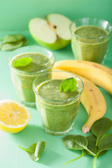 healthy green spinach smoothie with apple lemon banana