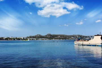 Obraz premium Boat Harbor in the Summer gorgeous Blue Water