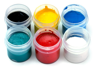 color paints in bottles  on white background