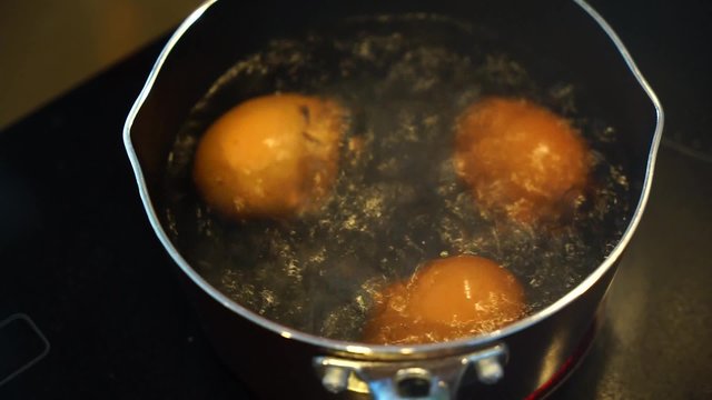 hen egg in boiling water