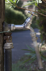 Outdoor water tap in a garden