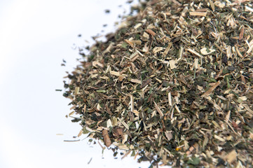 A bunch of nettle tea over white surface