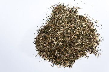 A bunch of nettle tea over white surface