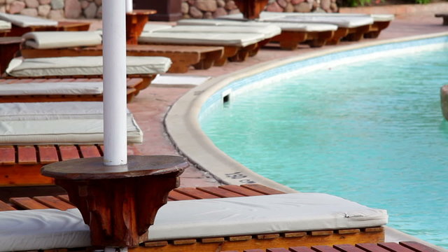 Fragment of nice luxury resort hotel with beautiful swimming pool
