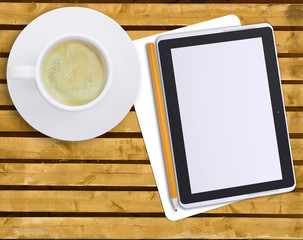 Fototapeta na wymiar Tablet with cup of coffee