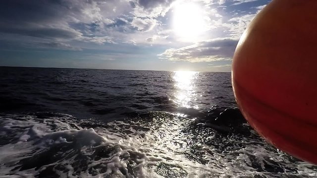 Boat Cuts Through The Ocean Water.