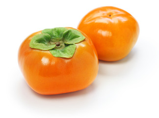 jiro kaki, japanese persimmon isolated on white wooden background
