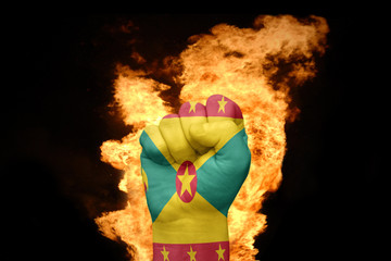fire fist with the national flag of grenada