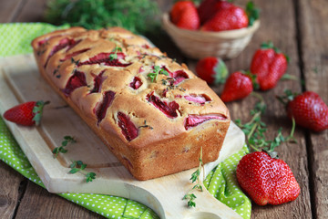 Homemade yogurt cake with fresh strawberries and thyme 