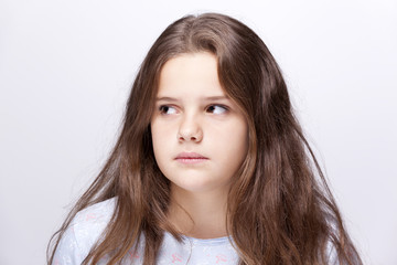 Sad girl on grey background