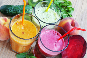 Fresh Detox Juices with Beet, Peaches, Spinach and Kiwi Fruit an