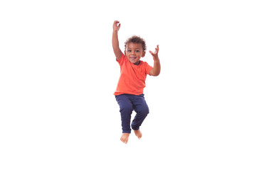 Portrait of a cute little African American boy jumping on a tram - obrazy, fototapety, plakaty