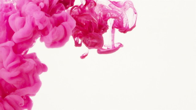 Pink and Magenta Color paint SLOWLY flowing in water. Suddenly a pink Color jet of  ink pigments starts quickly  dripping down and creates organic color smoke cloud under water. 