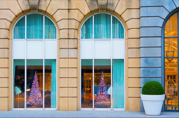 Modern Christmas tree window decoration in colorful building in Brussels, Belgium