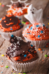Delicious Halloween cupcakes decorated with frosting 
