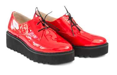 pair of red patent leather boots