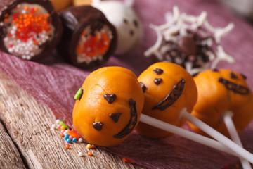 Beautiful Halloween cake pop pumpkin jack macro. horizontal
