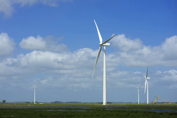 Fototapeta premium Green energy ecology windmill field sky background