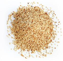 Heap of organic natural sesame seeds over white background