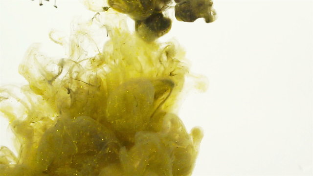 Yellow and Green Color paint flowing in water. Color jet of ink pigments  creates organic sculptures under water.