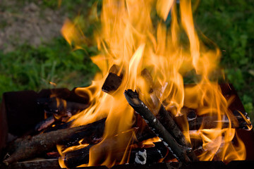 Camping bonfire in the the dark closeup view