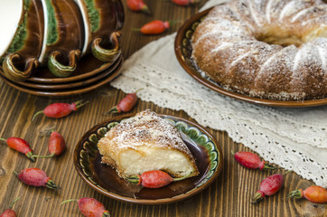 Curd pudding with semolina and apples seeding the powdered sugar   