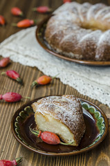 Curd pudding with semolina and apples seeding the powdered sugar   