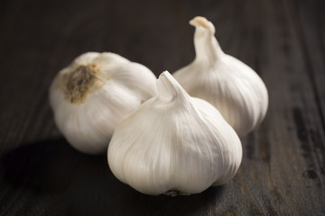 Three Whole Bulbs of Garlic on Table