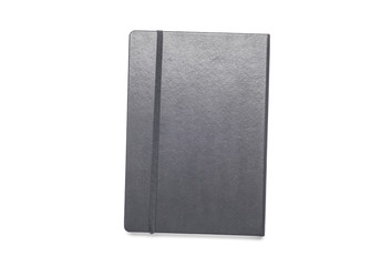 An unused black journal or notebook isolated on white background with shadow. Taken from a top down view.
