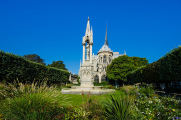 Jean XXIII Square, a park with a statue of Virgin Mary and the Christ child, is behind the Notre-Dame Cathedral on Ile Cite.