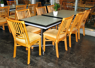 Fototapeta na wymiar glass table and wooden chairs