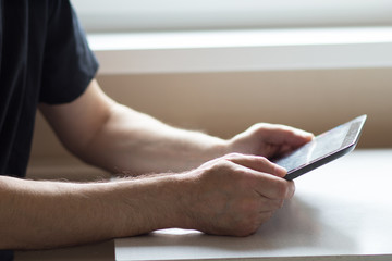 Closeup of man with tablet pc