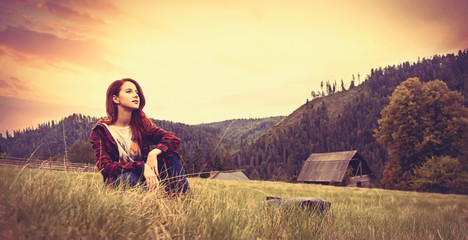 women sitting on the grass