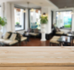 Wood table top with blur interior background