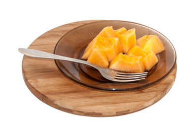 Yellow melon cut into pieces and served
