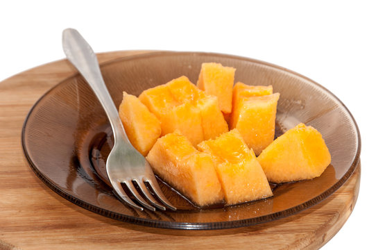 Yellow melon cut into pieces and served