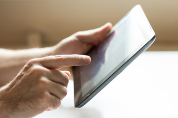 Closeup of man with tablet pc